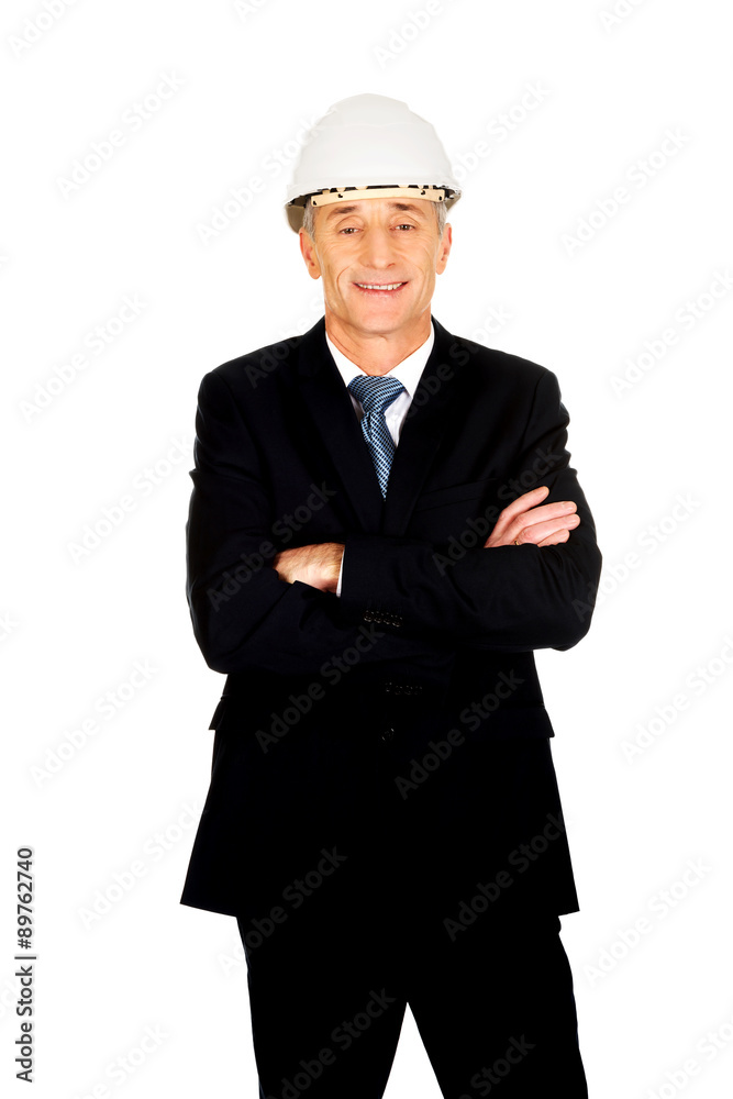 Smiling engineer with hard hat and folded arms Smiling engineer with hard hat and folded arms