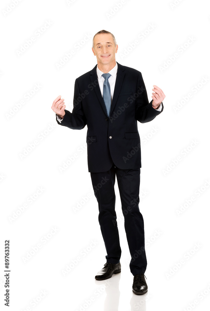 Businessman holding puzzle pieces Businessman holding puzzle pieces