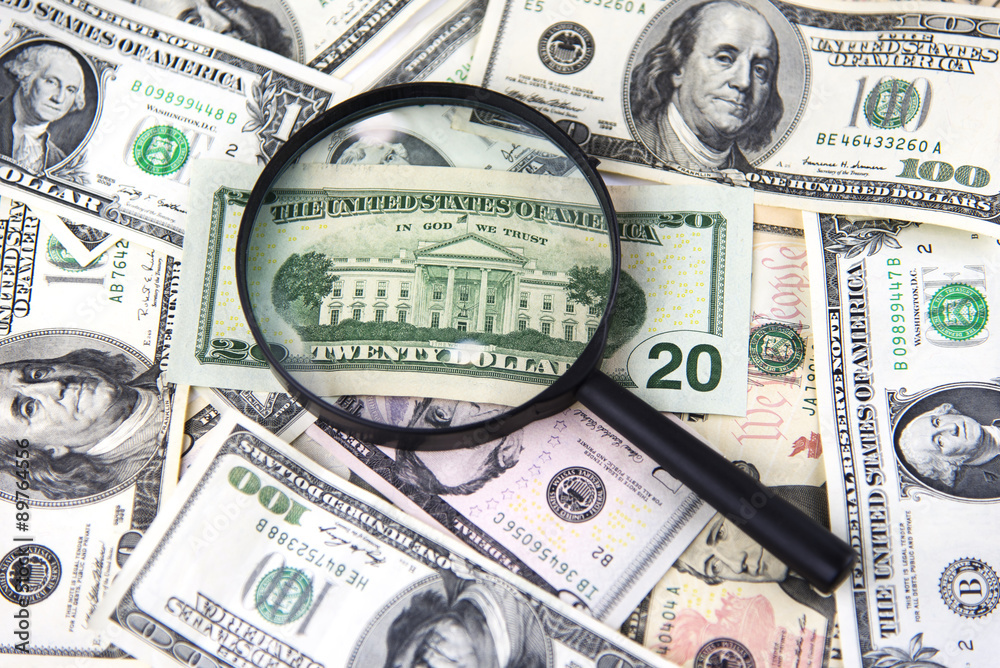 Money with magnifier