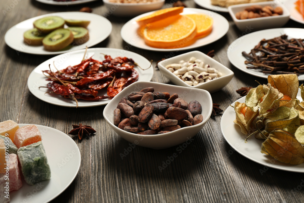 Different products on saucers on wooden table, closeup Different products on saucers on wooden table, closeup