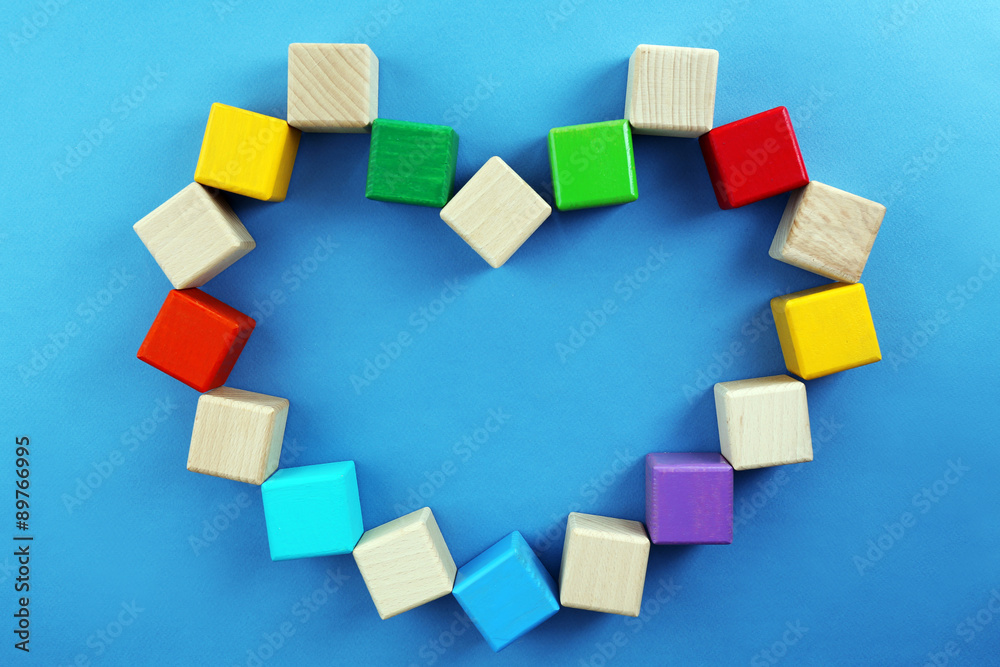 Colorful cubes in heart shape on blue background Colorful cubes in heart shape on blue background
