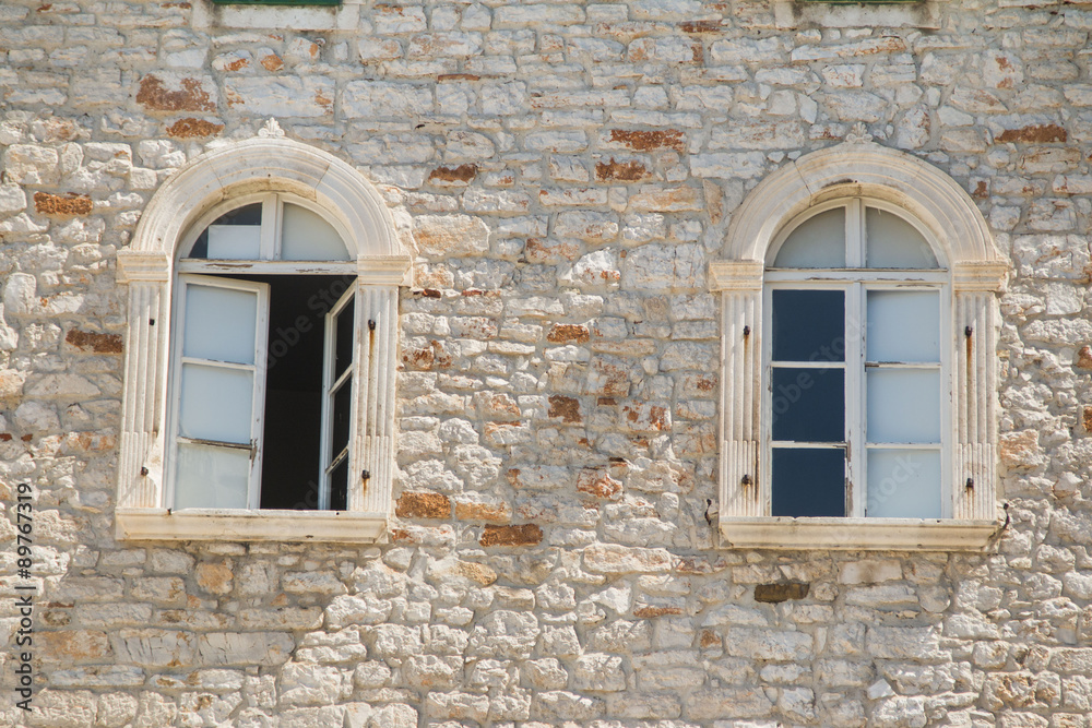 Windows on old traditional house in Sibenik, Croatia, facade details