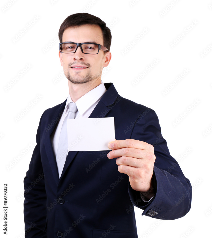 Elegant man in suit with business card isolated on white