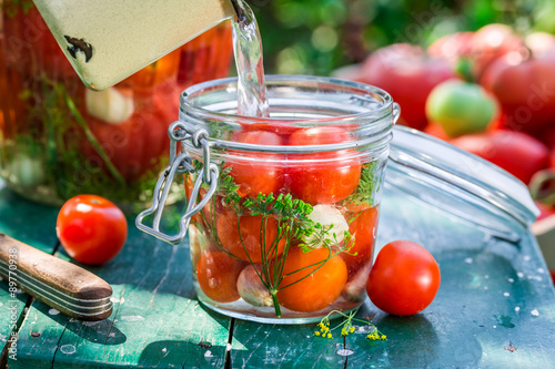 Ingredients for canned tomatoes in the jar