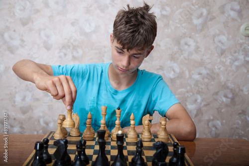 Teenager playing chess