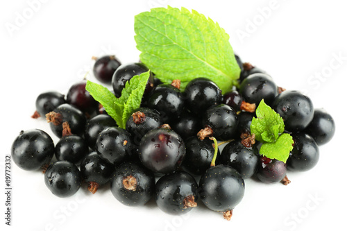 Ripe black currant isolated on white