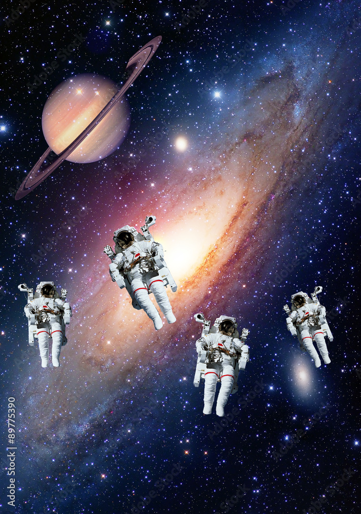 Astronauts spaceman outer space solar system saturn planet universe. Elements of this image furnished by NASA.