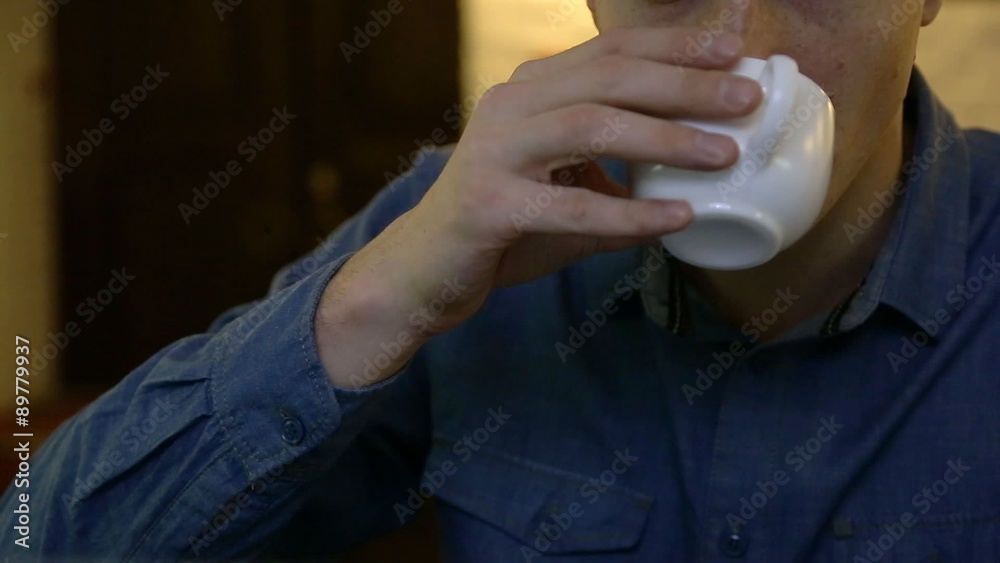 A man who drinks tea or coffee during working breaks. A man who drinks tea or coffee during working breaks.