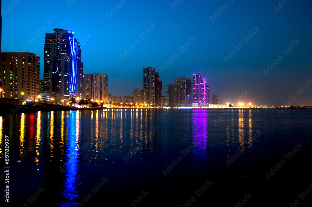 Sharjah downtown night scene with city lights, luxury new high