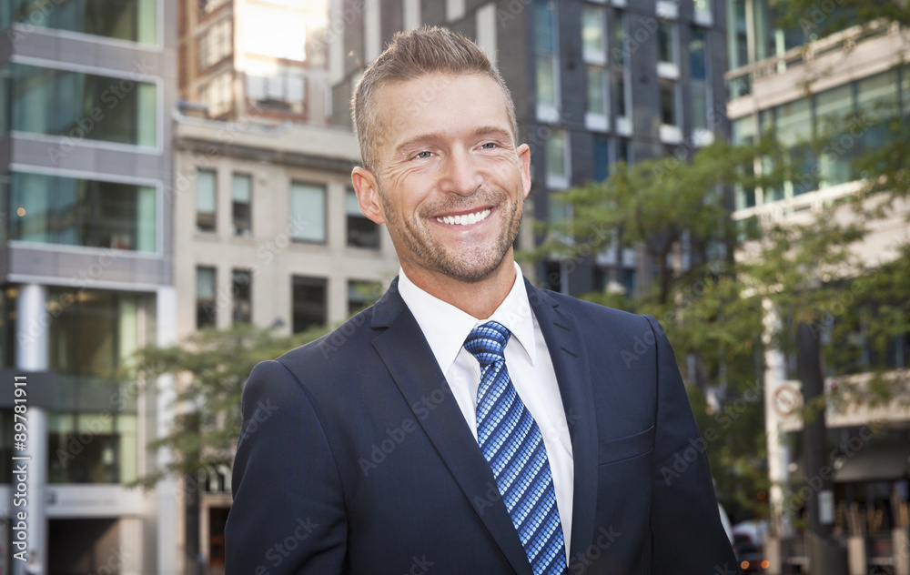 Mature Businessman Smiling At The Camera. He is outside of the office Mature Businessman Smiling At The Camera. He is outside of the office