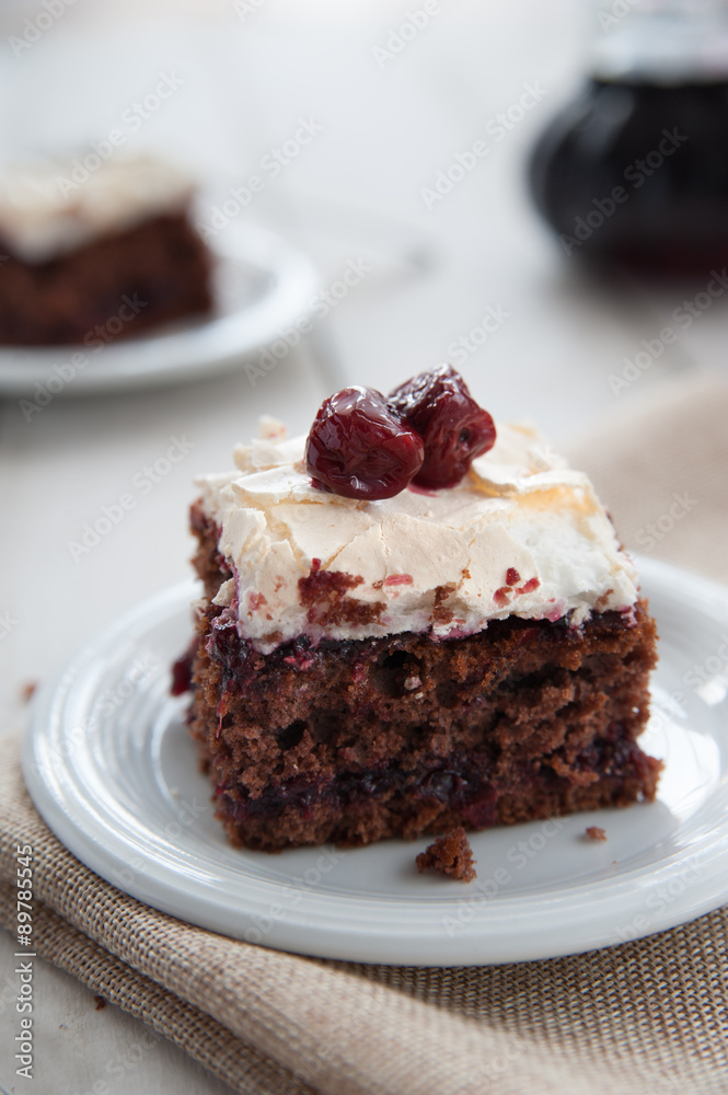 Piece of cherry and meringue cake