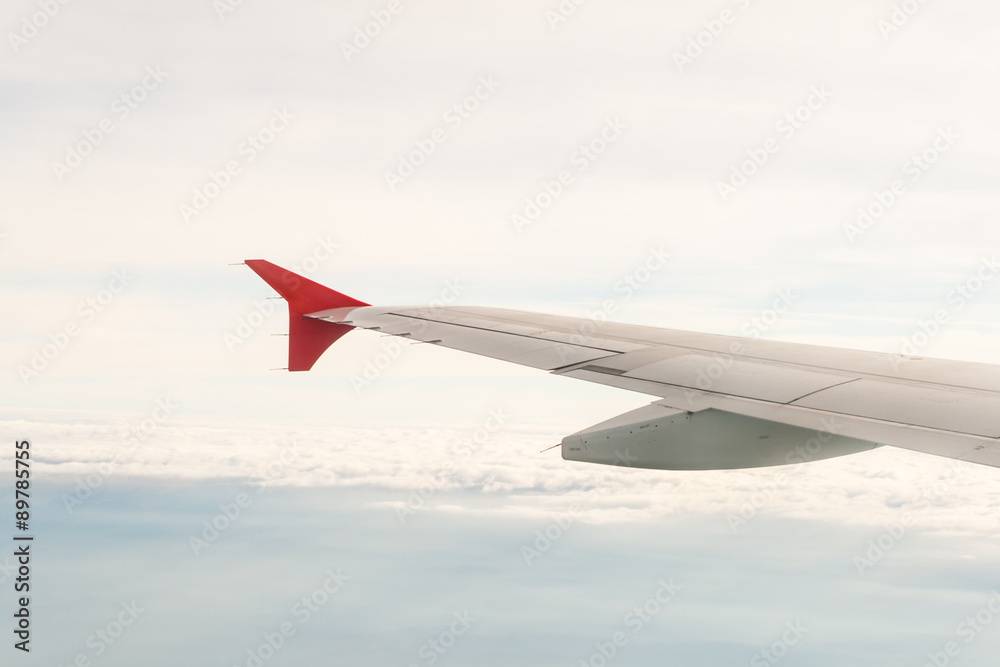 Obraz premium view from the plane on the wing and clouds