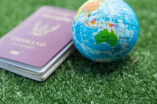 Photo of passport, money and world map. photo