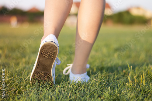 Girl running on the grass