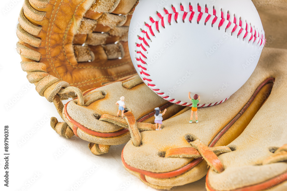 Fototapeta premium image of mini figure dolls with base ball glove and ball