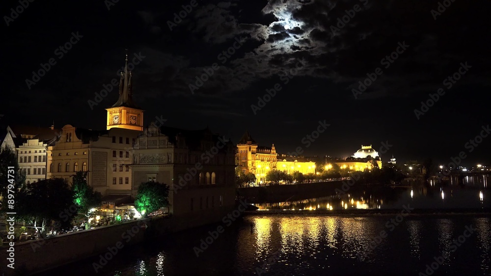 Stare Mesto with the Smetana embankment from the Charles Bridge at night with a full moon. Prague Stare Mesto with the Smetana embankment from the Charles Bridge at night with a full moon. Prague