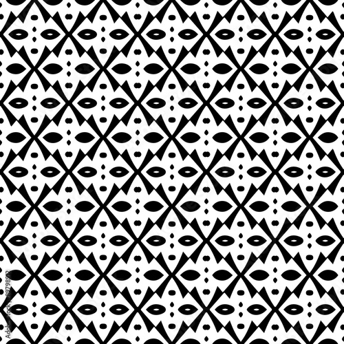 Abstract seamless pattern in black and white. Hand drawn ornamental wallpaper or textile pattern with white motives on black background.