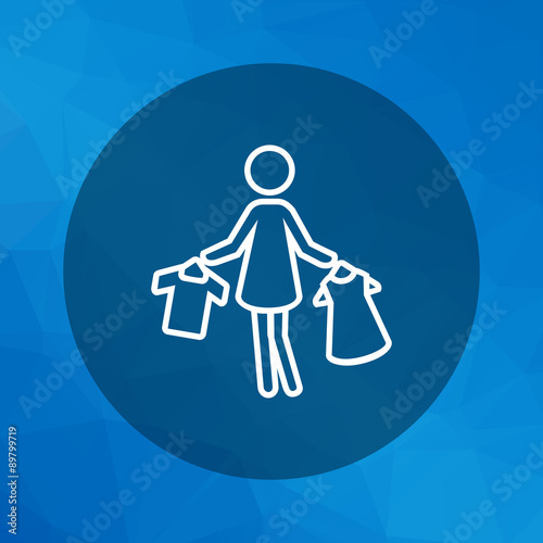 Woman holding clothes on hangers
