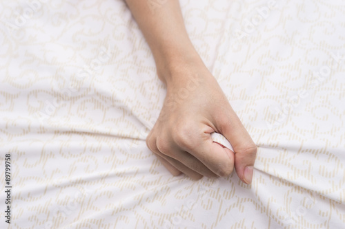 hand grasp bed sheet 1