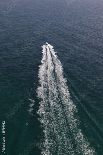 Small motor boat in the middle of the ocean © Image Supply Co