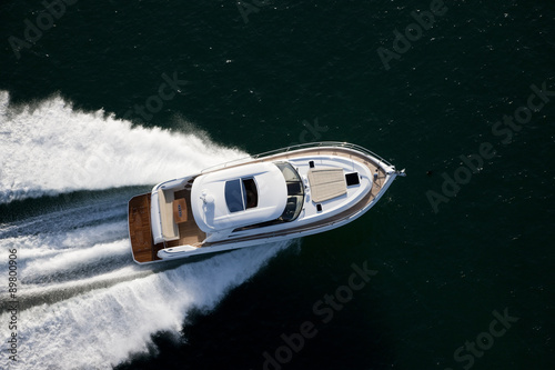 Beautiful motor boat dashing through a sea © Image Supply Co