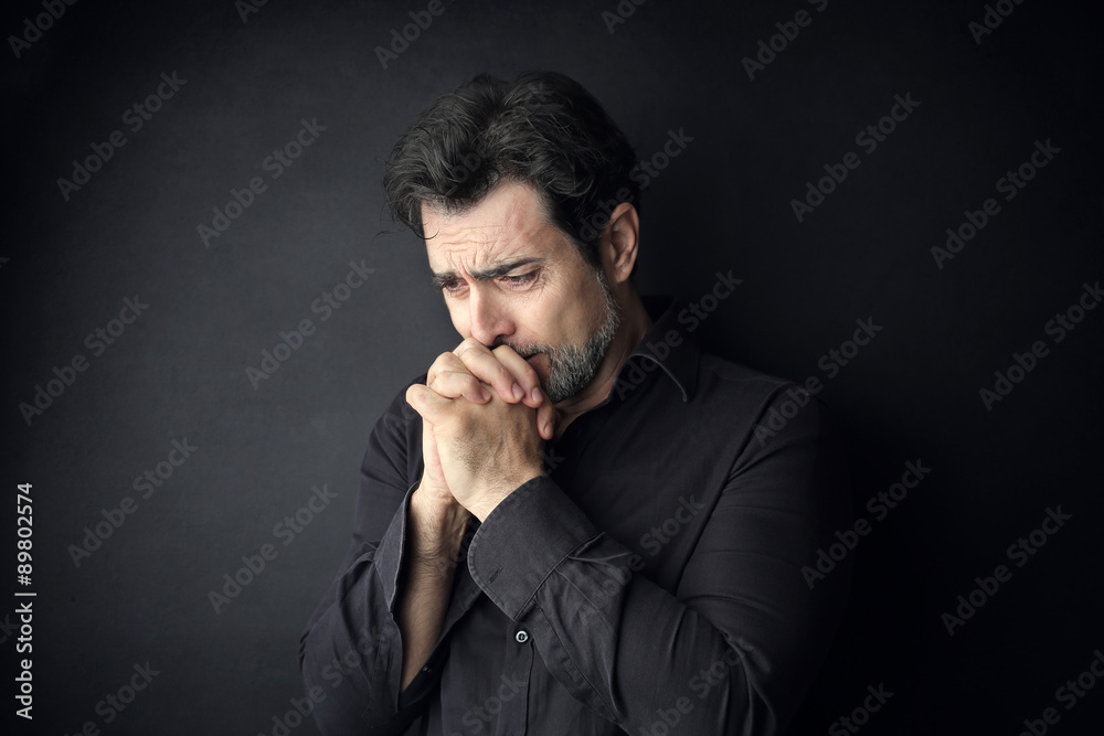 Desperate man praying for something Desperate man praying for something