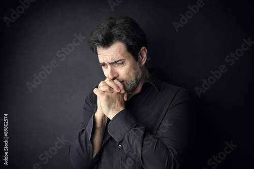 Desperate man praying for something