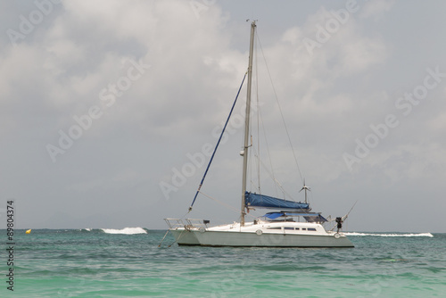 White catamaran on azure water against blue sky, Caribbean Islands