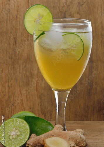 Lemonade and ginger  isolated on wooden background.