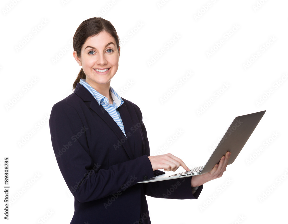 Brunette young businesswoman use of the notebook computer Brunette young businesswoman use of the notebook computer
