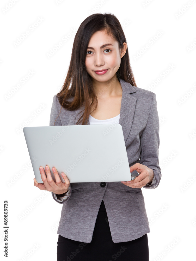 Young businesswoman use of the notebook computer Young businesswoman use of the notebook computer