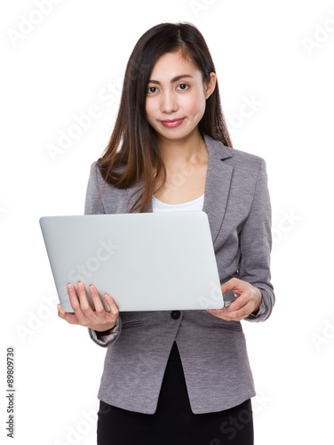 Young businesswoman use of the notebook computer © leungchopan