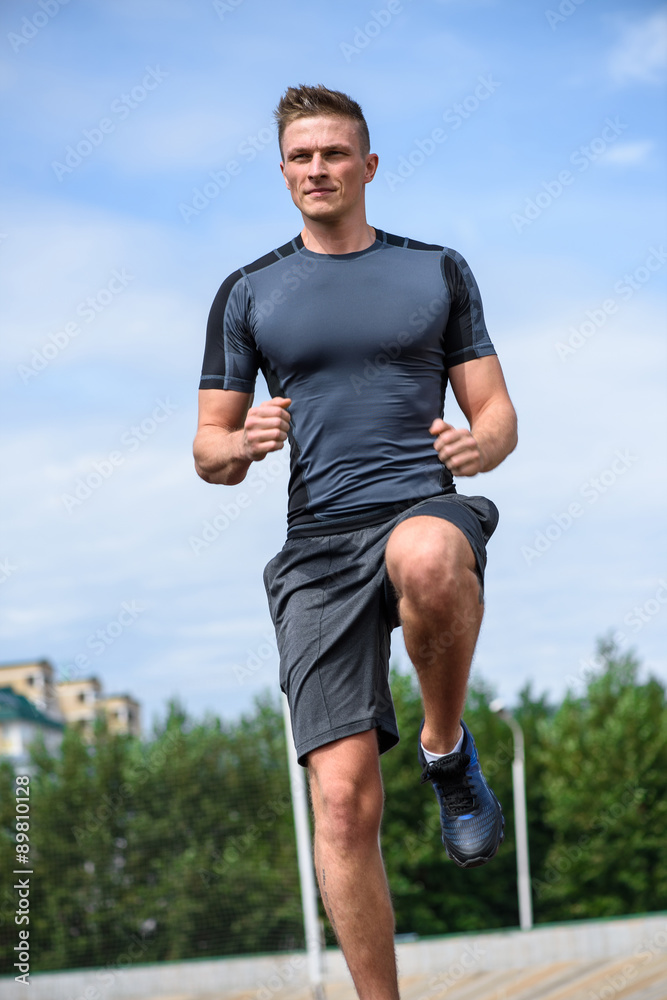 Fototapeta premium Running man on the stadium