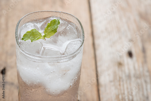 Soft drink strawberry soda and ice cube.