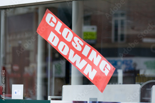 Closing Down sign in shop window photo