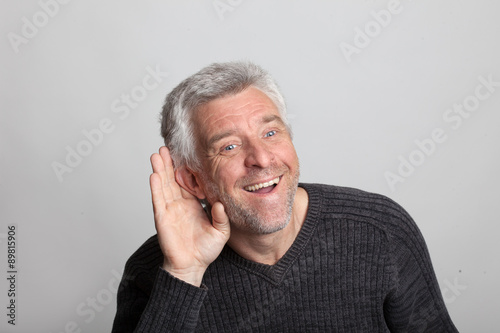 Obraz na płótnie deaf older gray-haired man