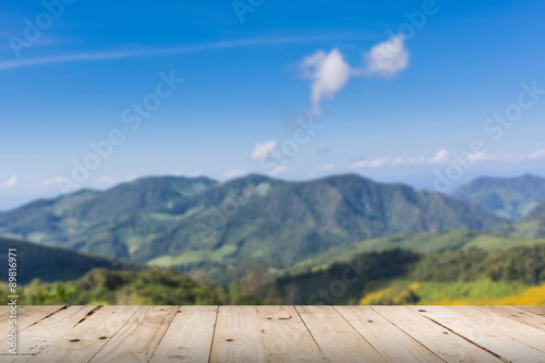 wood floor and view blurred mountain with space