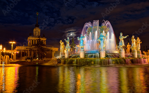 fountain Friendship of the people in Moscow on VDNH in evening illumination in a full moon