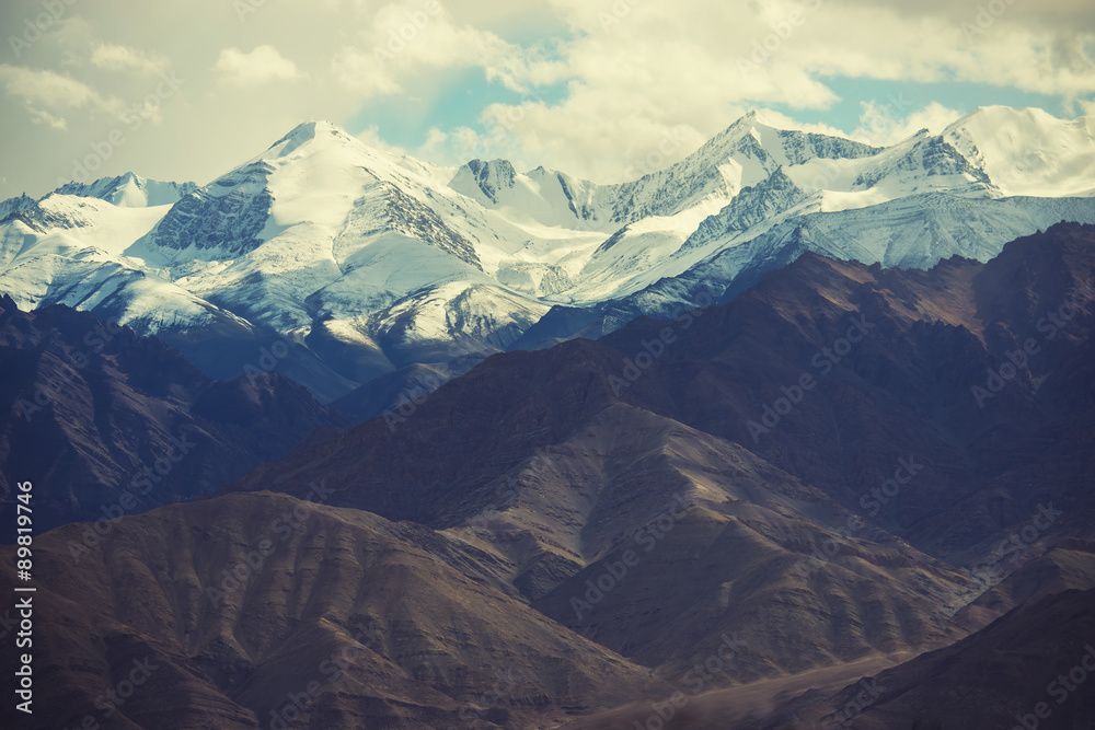 Scenic view of snow mountain mange take from Leh city , Ladakh ,India. Filter : cross processed vintage tone. Scenic view of snow mountain mange take from Leh city , Ladakh ,India. Filter : cross processed vintage tone.
