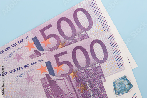 Two 500 euro notes on light blue backgrond photo