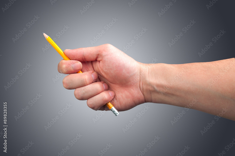 Pencil in hand. Isolated Pencil in hand. Isolated