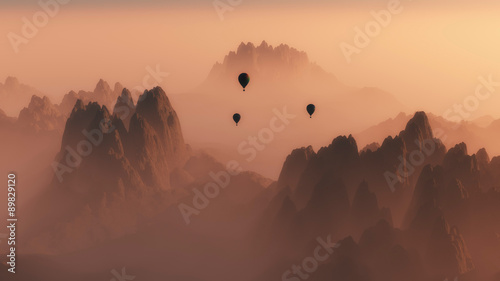High angle view of rocky mountain landscape with hot air balloon