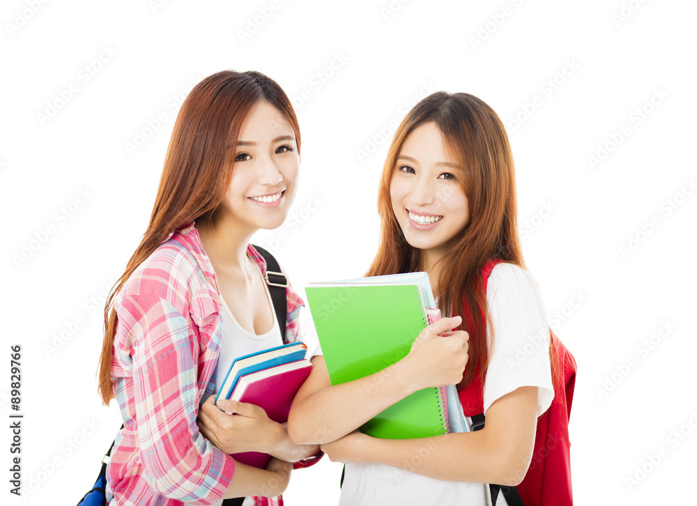 Two happy teenage students girls isolated on white Two happy teenage students girls isolated on white