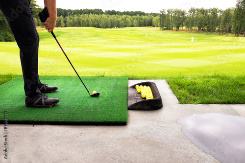 playing golf on a golf course in cloudy weather