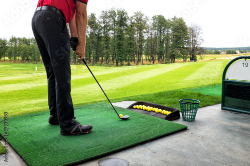 playing golf on a golf course in cloudy weather