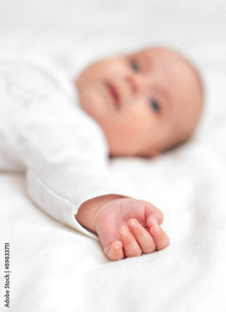 Cute little baby on the bed. Place for your text. Cute little baby on the bed. Place for your text.