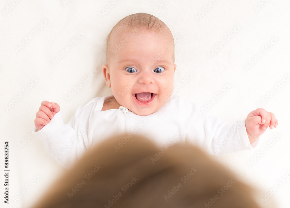 Mother playing with cute little baby. Mother playing with cute little baby.