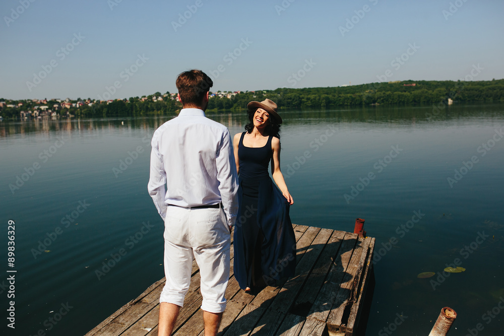 couple spends time on the wooden pier