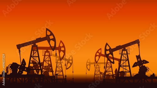Oil pumps over sunset.