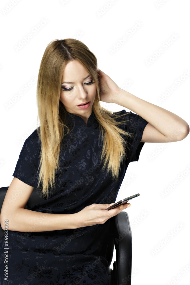 Beauty woman using and reading a smart phone isolated on a white